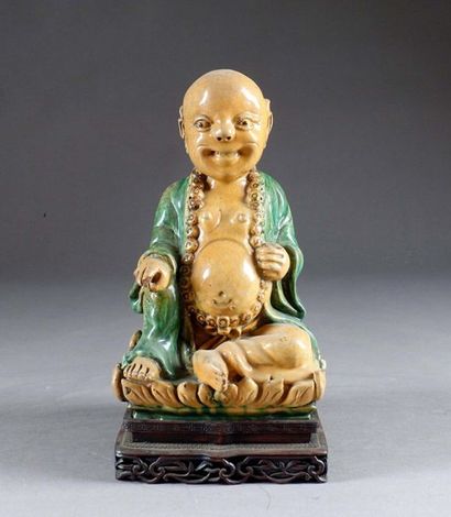 Milefo.
Shown sitting and smiling, a large...