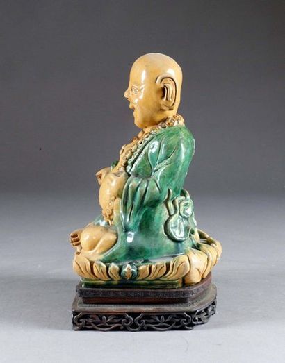 Milefo.
Shown sitting and smiling, a large...