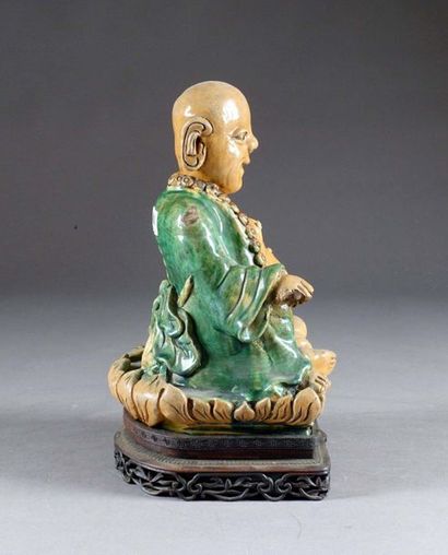Milefo.
Shown sitting and smiling, a large...