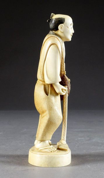 Okimono.
Figuring a peasant, with a hoe,...