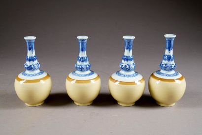 Suite de quatre petits Vases balustre. A...