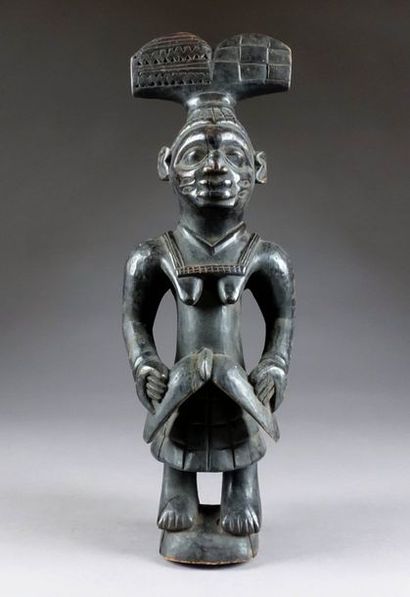 Yoruba. Figurine féminine Oshe Shango. Bois...
