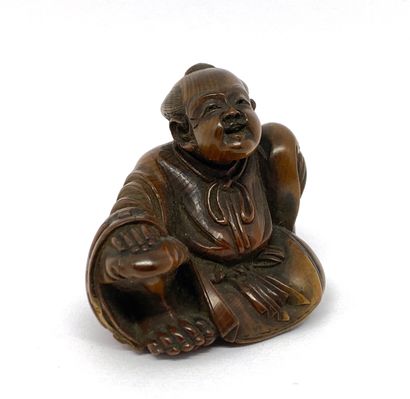 JAPON

Netsuke en bois figurant un personnage...