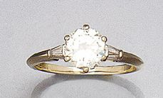 BAGUE en or gris ornée d'un brillant d'environ...