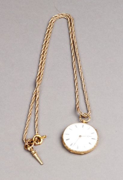 MONTRE de col en or jaune ciselé de rinceaux...