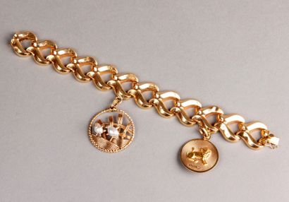 BRACELET en or jaune, mailles creuses entrelacs,...