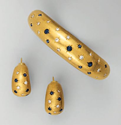 PARURE en or jaune comprenant un BRACELET...