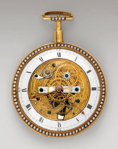MONTRE SQUELETTE en or doré et gravé de rinceaux...