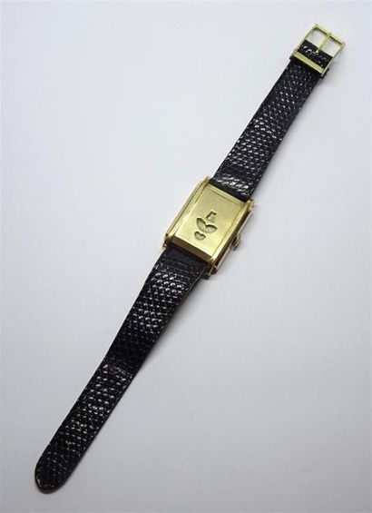 Montre à disques en métal doré dite 