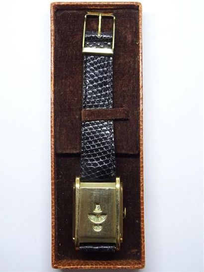 Montre à disques en métal doré dite 