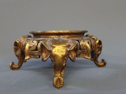 Bronze base with elephant head decoration....