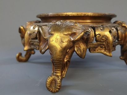 Bronze base with elephant head decoration....