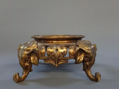 Bronze base with elephant head decoration....