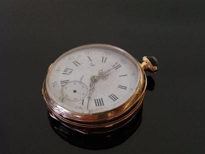 Pocket watch in gold and 750°/ 00 gold binoculars....