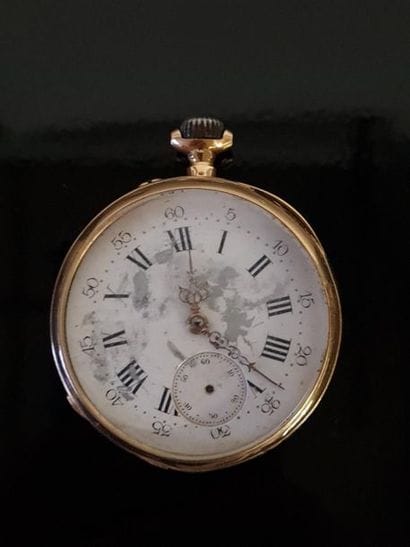 Pocket watch in gold and 750°/ 00 gold binoculars....