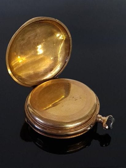 Pocket watch in gold and 750°/ 00 gold binoculars....