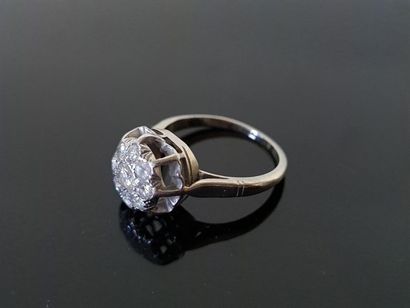 Platinum ring set with diamonds, a central...