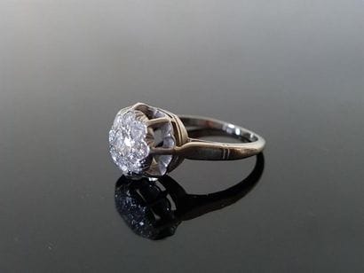 Platinum ring set with diamonds, a central...
