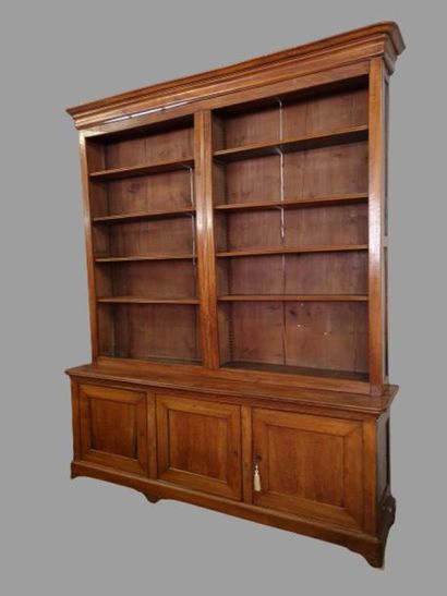 Large bookcase in fruit-wood with three doors...