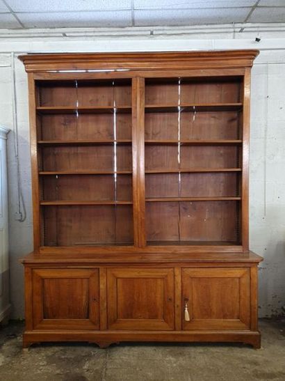 Large bookcase in fruit-wood with three doors...