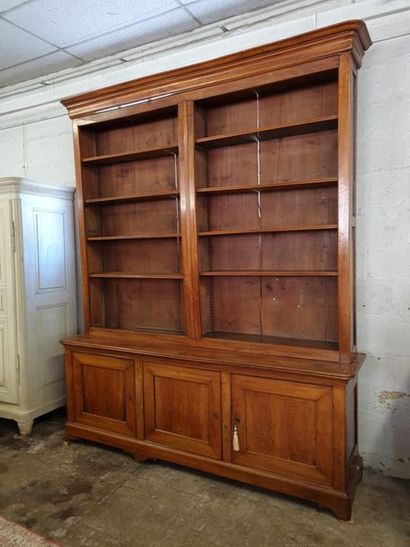 Large bookcase in fruit-wood with three doors...
