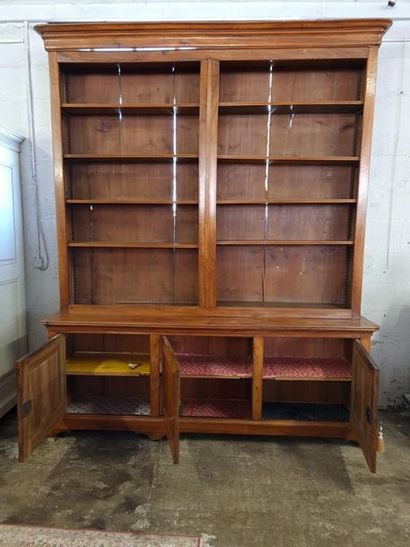 Large bookcase in fruit-wood with three doors...