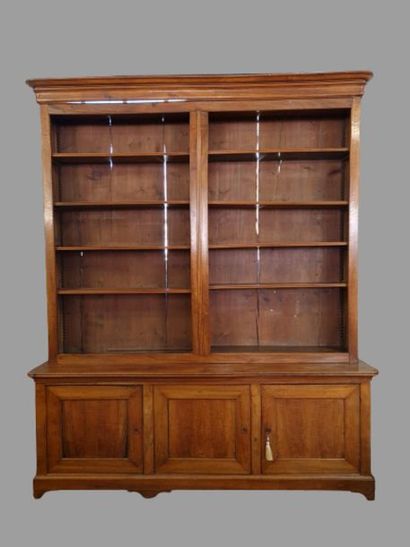 Large bookcase in fruit-wood with three doors...