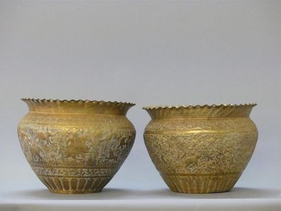 Two repoussé and gilded copper pots with...
