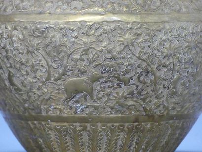 Two repoussé and gilded copper pots with...