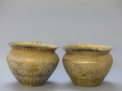Two repoussé and gilded copper pots with...