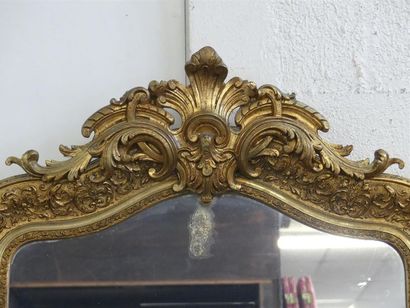 Mirror with gilded stucco and wood frame.
Late...