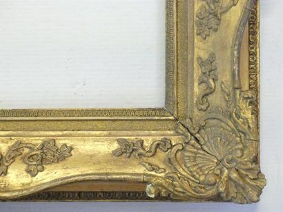 Wooden frame and gilded stucco surmounted...