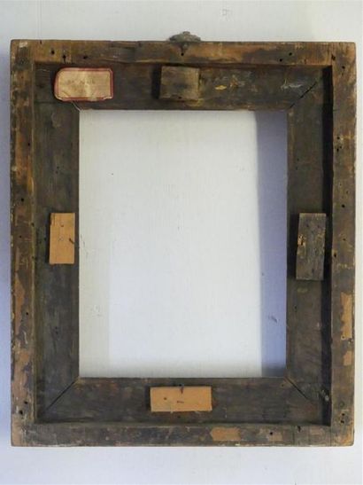 Wooden frame and gilded stucco surmounted...