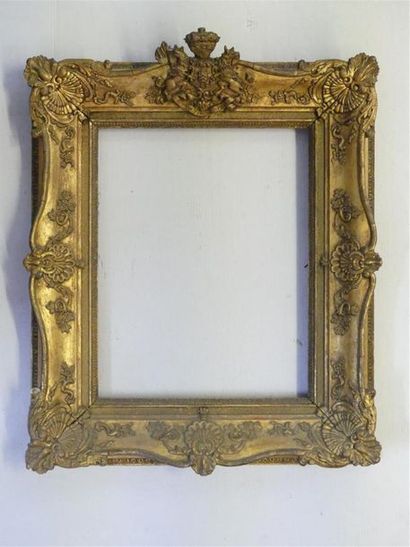 Wooden frame and gilded stucco surmounted...