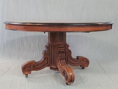 Table with central foot in walnut and stained...