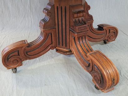 Table with central foot in walnut and stained...