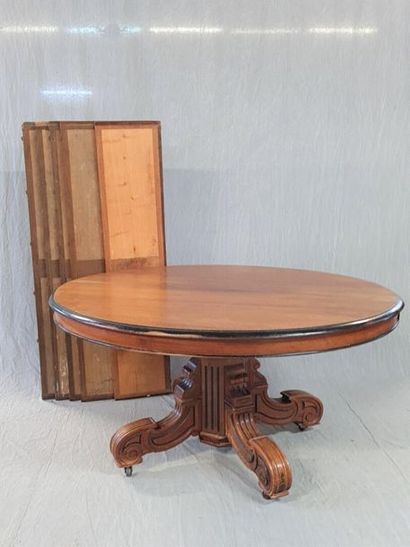 Table with central foot in walnut and stained...