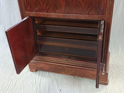 Upright mahogany secretary, the flap revealing...