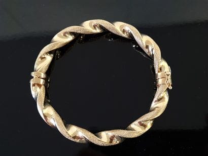 Articulated twisted rigid bracelet in 750°/00...