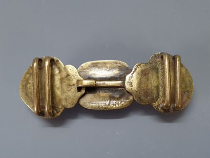 Bronze belt buckle and three hard stone cabochons....