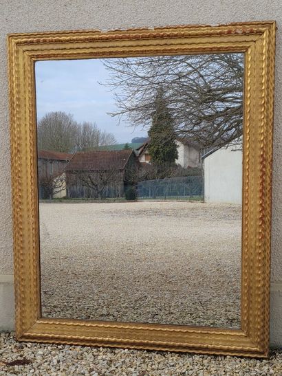 Large mirror, wooden frame and gilded stucco....