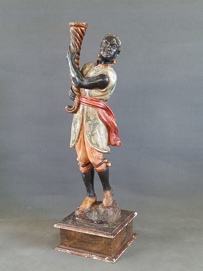 Lampadaire figurant un nubien tenant une...