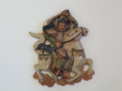 Glazed ceramic bas relief depicting an Asian...