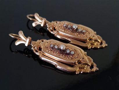 Pair of 750°/00 gold ear pendants set with...