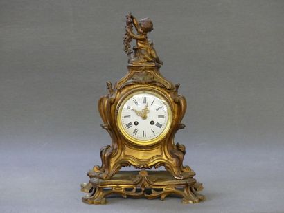 Bronze cartel surmounted by a love.

Rocaille...
