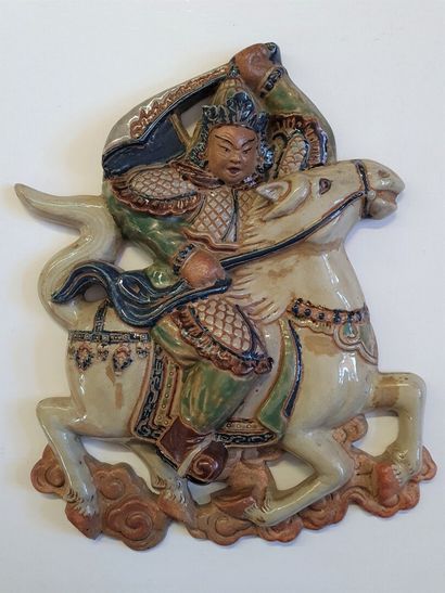 Glazed ceramic bas relief depicting an Asian...