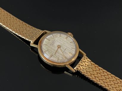 UNIVERSAL Genève, Montre de dame en or 750°/00,...