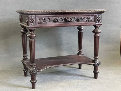Table desserte en acajou à décor sculpté...