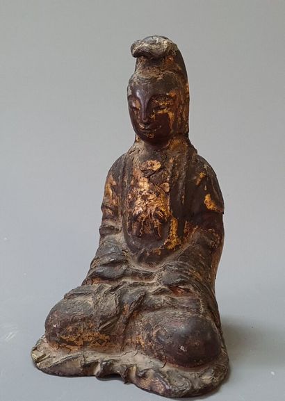 Guan Yin 

Statuette en fonte de fer , traces...
