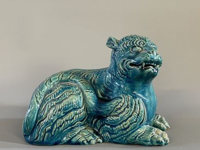 Chien de fo en terre cuite émaillé. 

13...